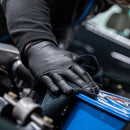 Box of Bodyguards GL897 black nitrile gloves in a workshop setting